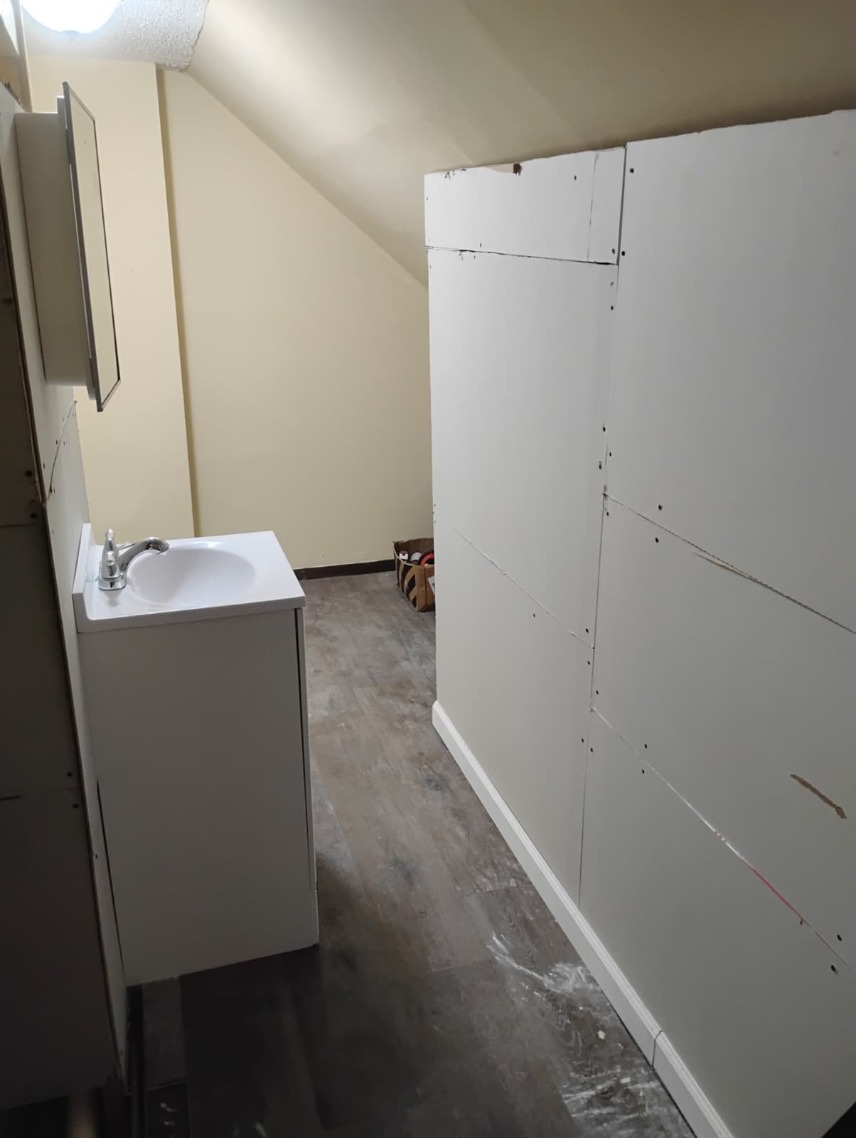 Drywall hung on the new bathroom walls